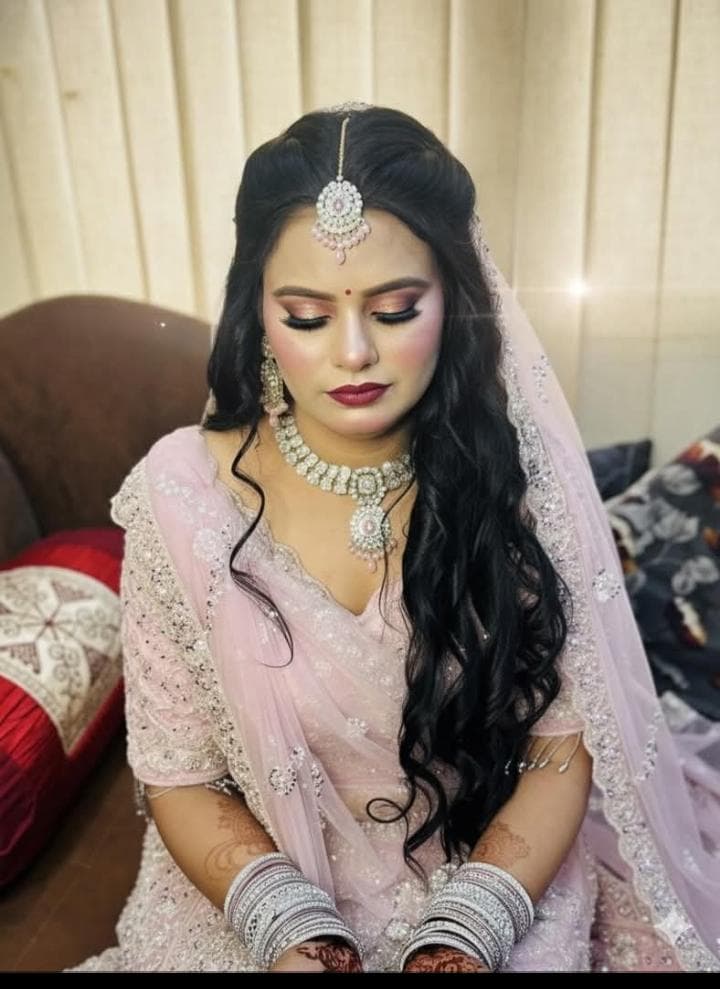 Bride with bridal makeup by Radha Rani Parlour